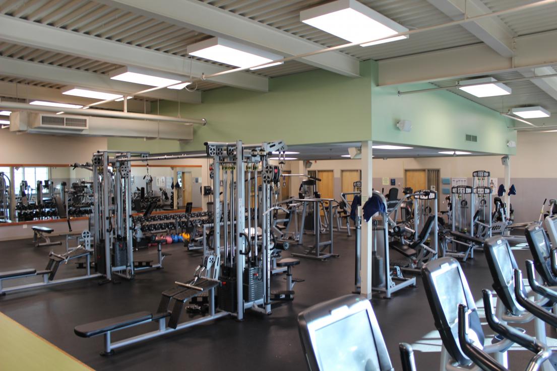 Image of empty gym with a variety of equipment