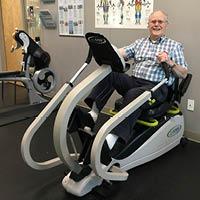 Man riding exercise bike