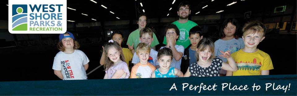 A group of kids and 2 leaders at summer camp
