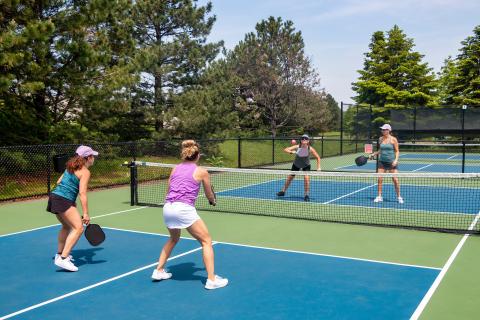 Pickleball players on an outdoor court